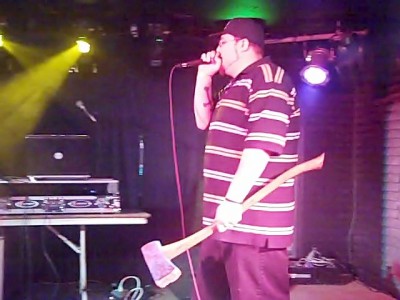 Militious goes everywhere with his axe. Even on stage.
